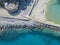 Aerial view of a pier with rocks and rocks on the sea. Pier of Pizzo Calabro, panoramic view from above. Calabria, Italy