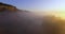 Aerial view of pink sunrise on misty valley