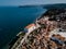 Aerial view on Piran town with old lighthouse, the port and St. George`s Parish Church