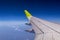 Aerial view from plane window with airplane wing