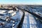 Aerial view of Podolsk cityscape and road overpass on winter sunny morning