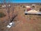 Aerial view of the police station buildings and a car wreck of the abandoned railway town called Putsonderwater, ghost town in