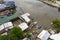 Aerial view of a poor shanty town by a small river. At an impoverished coastal area in the town of Ubay, Bohol. Example of urban