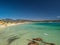 Aerial view of Porto Giunco beach and tower in Villasimius, Sardinia, Italy