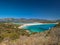 Aerial view of Porto Giunco beach and tower in Villasimius, Sardinia, Italy