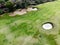 Aerial view of pound on golf course with player.