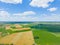 Aerial view of powerful Wind turbine farm for energy production on beautiful cloudy sky at highland. Wind power turbines