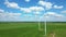 Aerial view of powerful Wind turbine farm for energy production on beautiful cloudy sky at highland. Wind power turbines