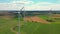 Aerial view of powerful Wind turbine farm for energy production on beautiful cloudy sky at highland. Wind power turbines
