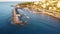 Aerial view of Puerto de Bordighera coast houses by the sea with rows of boats in Imperia, Italy