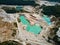 Aerial view quarry extraction porcelain clay, kaolin, with turquoise water