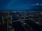 Aerial view of Queensboro Bridge and Roosevelt Island after sunset. Evening panoramic shot of city lights in urban