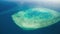 Aerial view of Queensland Coral Reef Island from a flying airplane. Slow motion