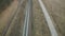 Aerial view: railway, road in the field