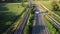 Aerial view, railway and road in rural landscape.