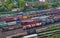 Aerial view of railway yard with freight rail wagons. Cargo trains with goods on railroad. Freight train with petroleum tank cars