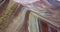 Aerial view of the Rainbow mountain and Andes peaks of Peru