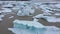 Aerial view of rapid melting glaciers and icebergs in Greenland by drone due climate change