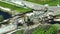 Aerial view of reconstruction of damaged road bridge destroyed by river after flood water washed away asphalt