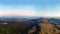 Aerial view of the Recreation Mountain Pysany kamin in Carpathian mountains. autumn. Pine forest, houses on the peaks, yellow