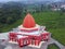 Aerial view of a red Masjid Merah mosque in Indonesia