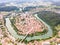 Aerial view of red roofs of Novo Mesto, Slovenia. Historic Kandija iron bridge Old Bridge, on the bend of the Krka River.