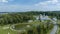 Aerial View Religious Complex With Multiple White Buildings Shining Golden Domes, Pond With Fountain