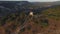 Aerial view on remains of an ancient observation tower in the mountains. Shot. Watch tower of the ancient city in the