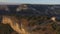 Aerial view on remains of an ancient observation tower in the mountains. Shot. Watch tower of the ancient city in the