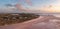 Aerial view of remote beach huts on the Northumberland coast at Embleton Bay