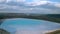 Aerial view of a reservoir full of blue toxic sludge