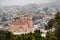 Aerial view of a residential area in the Inner Sunset neighborhood on a foggy summer day; St. Anne of the Sunset Catholic Church