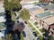 Aerial view residential area with row of townhomes and bright fa