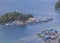 Aerial view of residential areas on small islands in Yos Sudarso Bay, around Jayapura City, Papua, Indonesia.