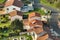 Aerial view of residential houses in green suburban rural area