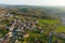 Aerial view of residential houses in green suburban rural area