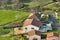 Aerial view of residential houses in green suburban rural area