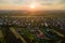 Aerial view of residential houses in suburban rural area at sunset