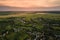 Aerial view of residential houses in suburban rural area at sunset