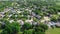 Aerial view residential neighborhood surrounded by matured trees and grassland in Flower Mound, Texas, US