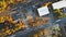 Aerial view of residential quarters at beautiful town urban landscape of train on railroad in fall autumn on mist trees