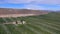 Aerial View of Rich Farmland in the Okanogan Valley below Satellite Dish Filled Hilltop