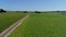 Aerial View of Rich Farmlands and Corn Fields Along a Single Railroad Track