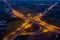 Aerial view ring road and interchange connecting the city at night