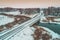 Aerial view of river concrete bridge in snowy winter