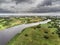 Aerial view on River Corrib, Galway city and bay, Burren mountains in the background, Cloudy sky