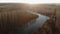 Aerial view of the river with dry trees on the banks in autumn. Forest ecosystem, healthy environment. Ukraine