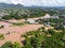 Aerial view river flood village countryside Asia and forest tree, Top view river with water flood from above, Raging river running