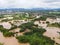 Aerial view river flood village countryside Asia and forest tree, Top view river with water flood from above, Raging river running