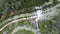 Aerial view of river flow, fishing boats and green mangrove forest